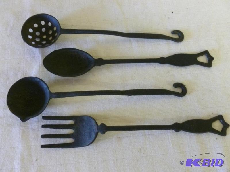 lot 117 image: Lot of four decorative cast iron wall utensil...
