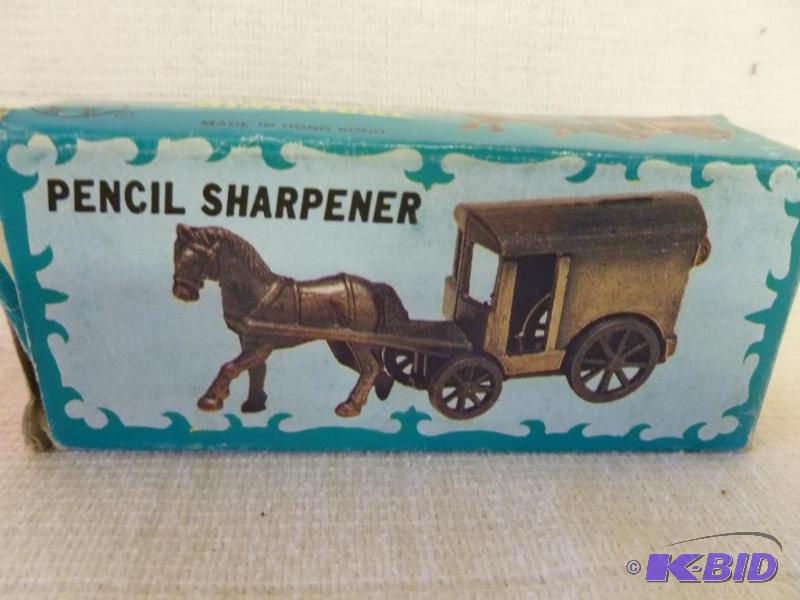 lot 148 image: Die Cast metal horse and buggy pencil sharpen...