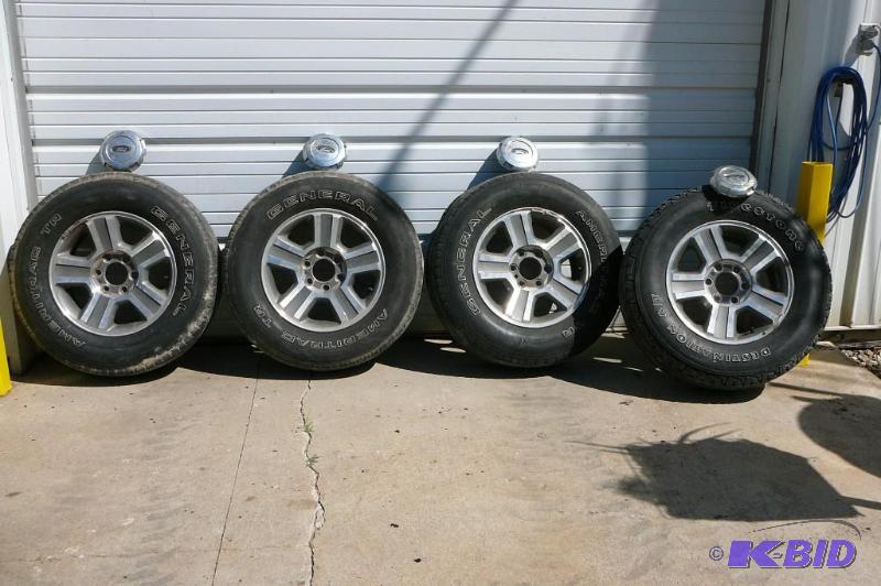 lot 4 image: Ford F150 Alum Rims with 2 tires Genreral Ame...