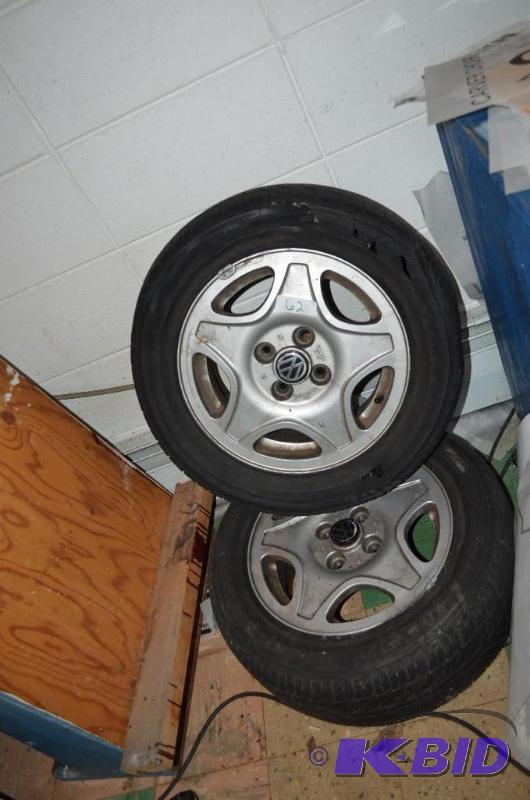 lot 62 image: 2 VW Volkswagen rims and tires- one bad tire ...