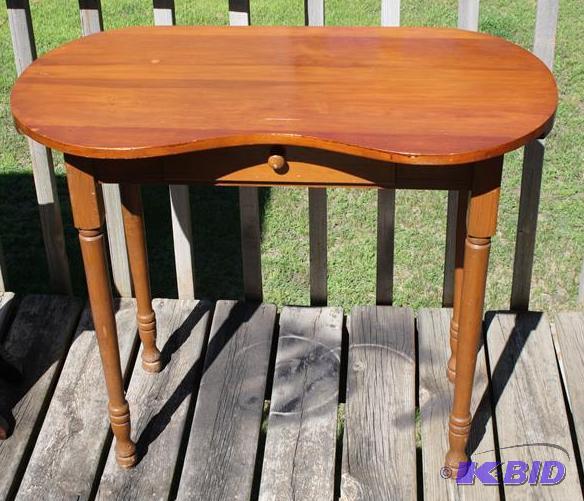 Wood table with single drawer and rounded edg...