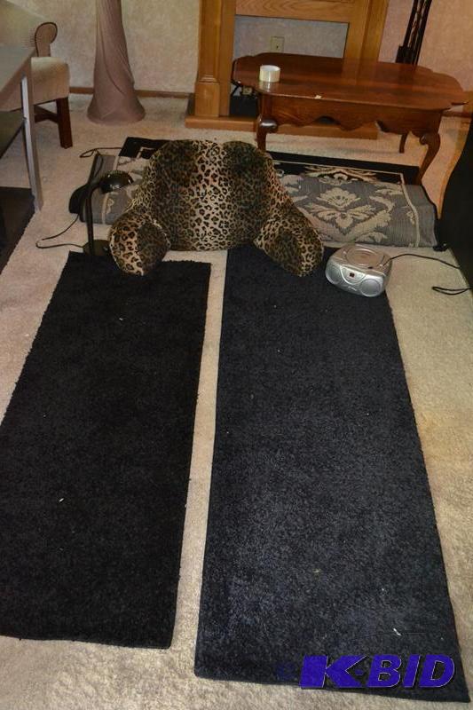 2 black carpet runners, leopard reclining pil...