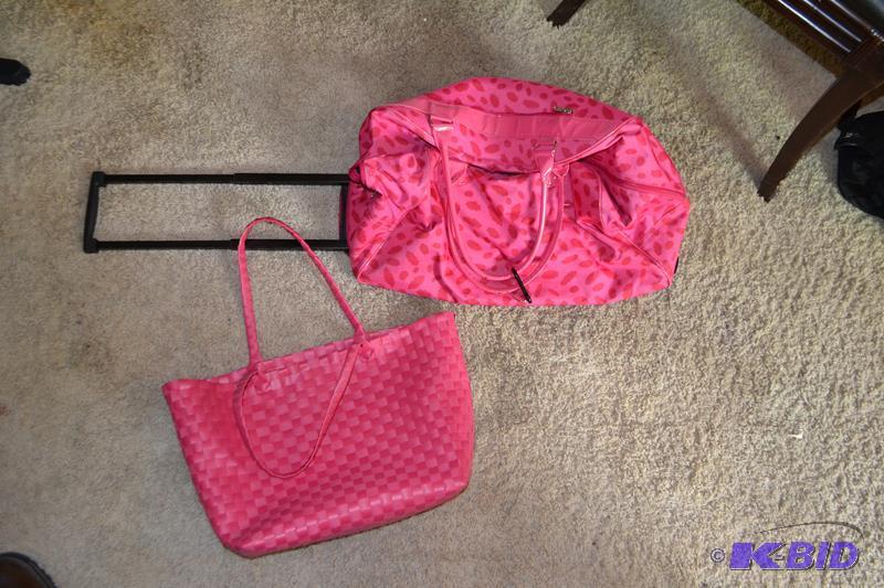 Pink rolling duffel bag, pink handbag...