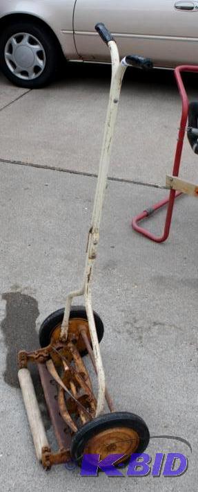 Vintage push reel mower in working condition...
