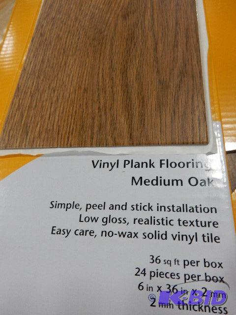5 Boxes of Vinyl Floor Covering, Oak finish. ...