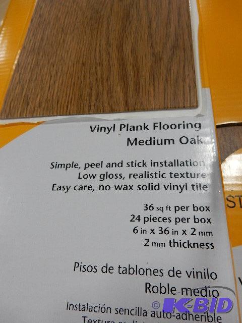 5 Boxes of Vinyl Floor Covering, Oak finish. ...