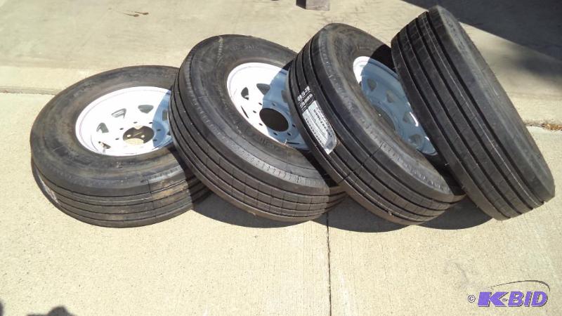 4 Brand new 14 ply trailer tires and rims.