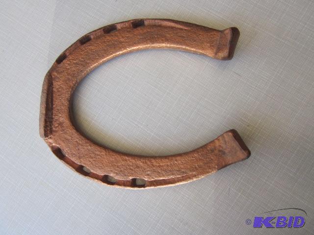 lot 133 image: Solid copper horse shoe....