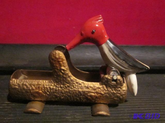 lot 51 image: Antique red headed wood pecker and metal toot...
