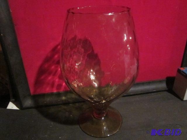 lot 85 image: Large 12 inch hand blown auburn colored glass...