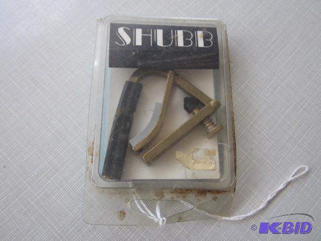 lot 98 image: Shubb for Capo for steal string guitar, new i...