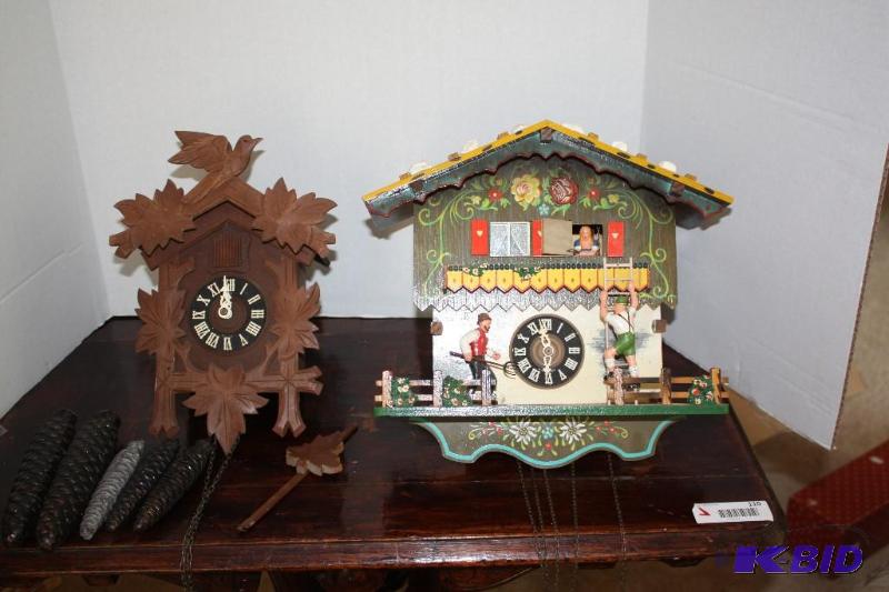 lot 105 image: German 8 day wood cuckoo clock with chain t...