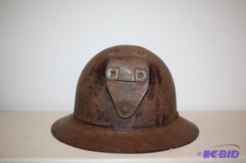 lot 106 image: Antique Miners Helmet with front attachment a...