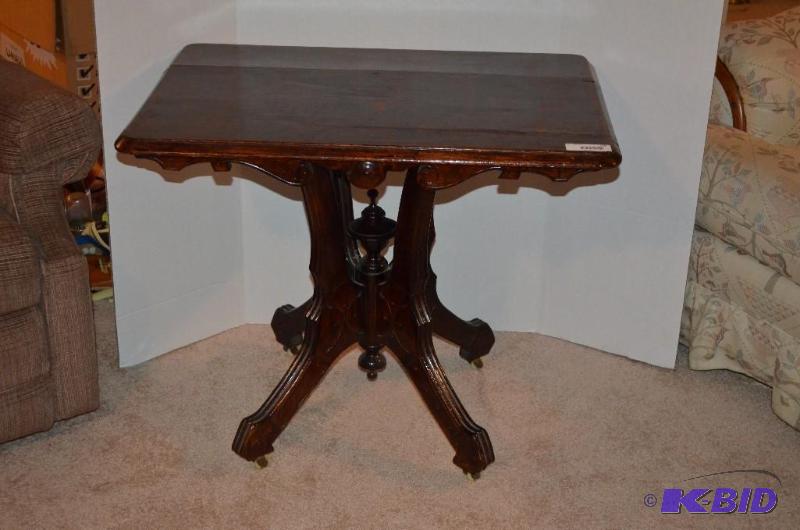 lot 110 image: Beautifully carved wood parlor table with whe...