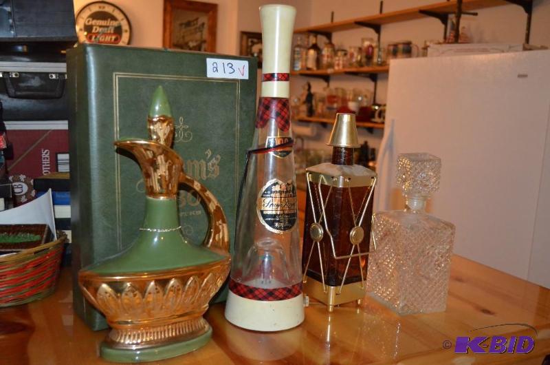 lot 213 image: Vintage Liquor Decanters, one plays Coming th...