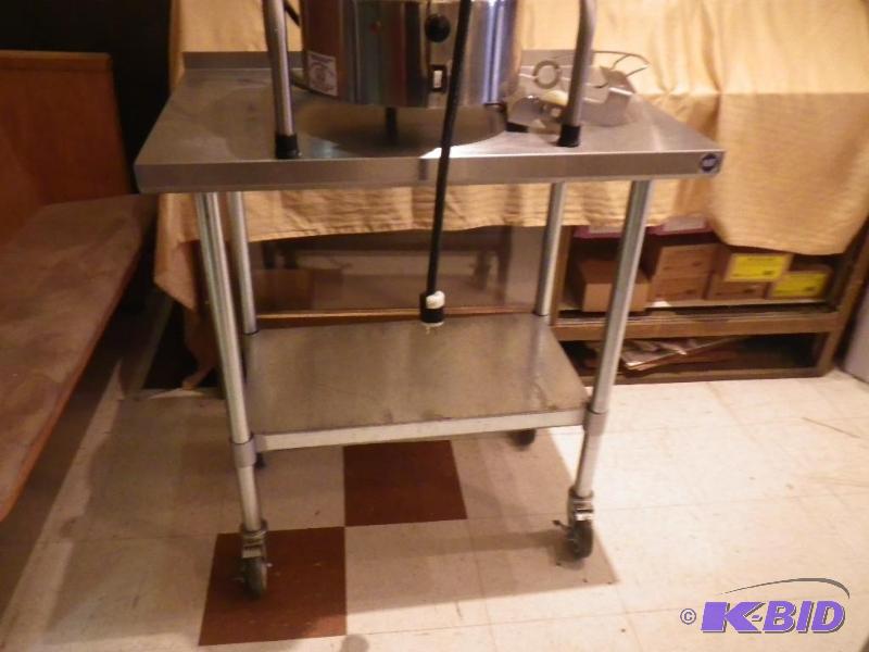 lot 24 image: Stainless Steel NSF table on casters 36"...