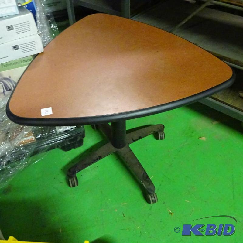lot 192 image: Triangle top table on wheels...