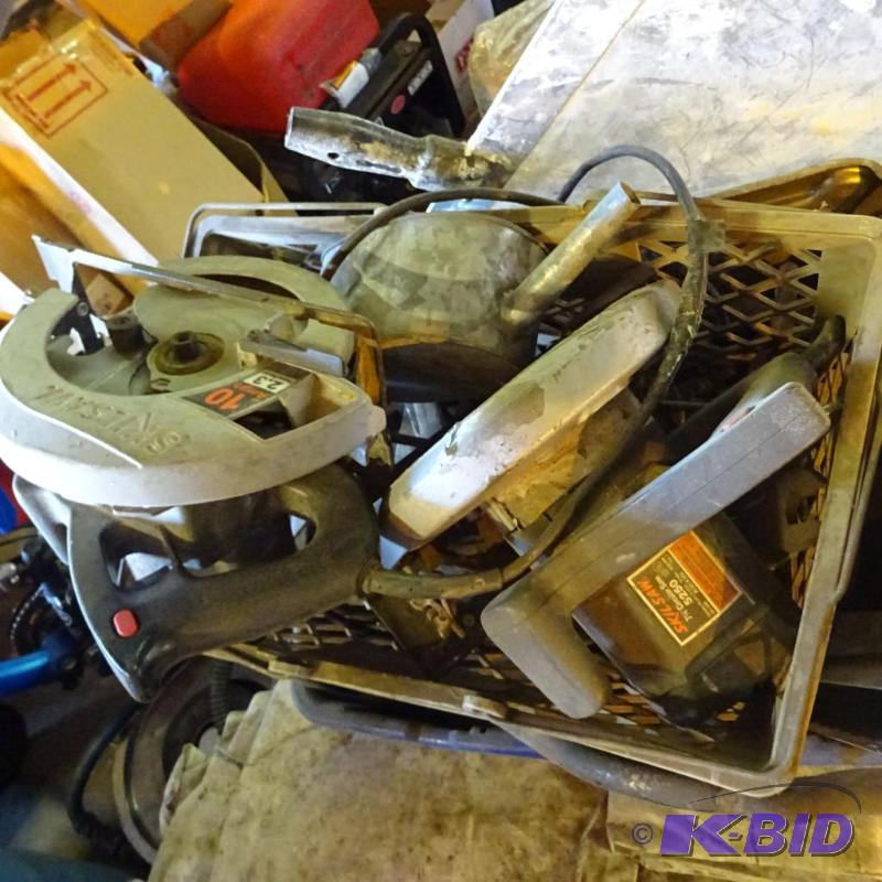 lot 52 image: Bin full of misc tools. 2 circular saws...