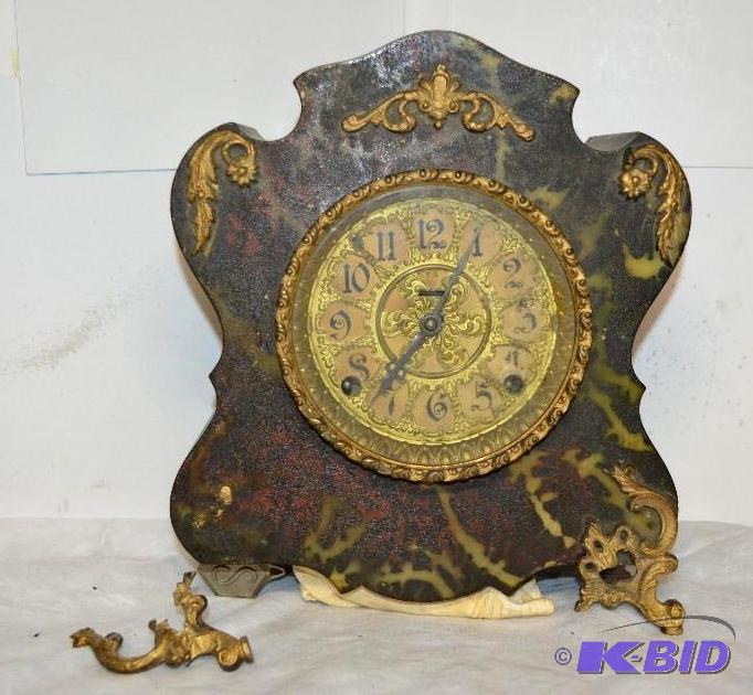 lot 19 image: Antique Clock 11 inches x 10 inches. There is...