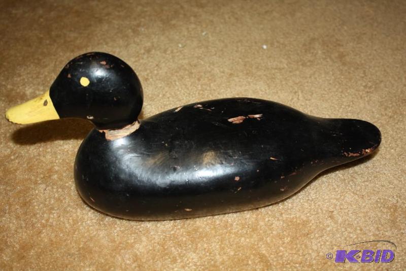lot 6 image: Antique&nbspBlack wood decoy with yellow bil...