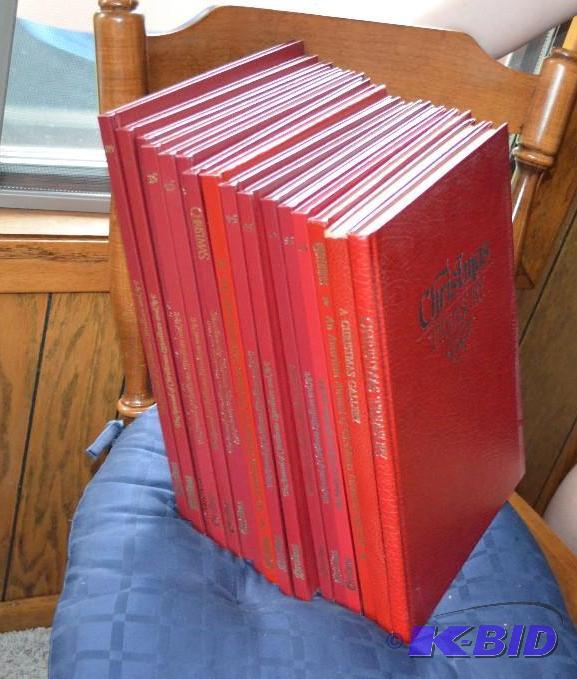 lot 92 image: Christmas Treasury - 16 volumes red hard cove...