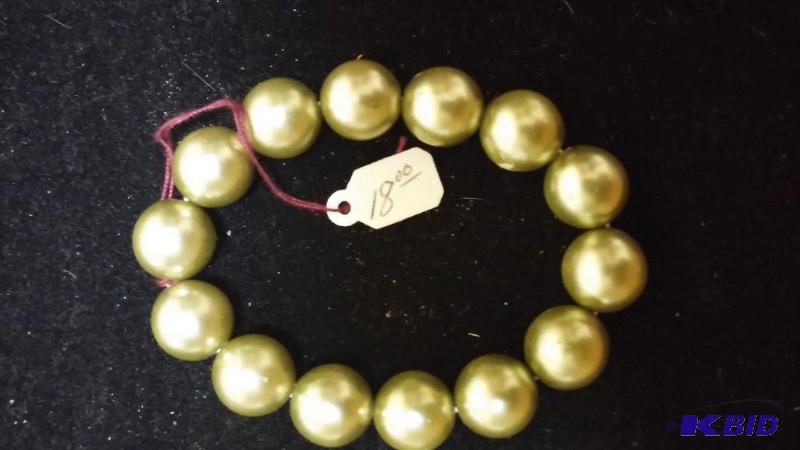 Designer Bracket with light green beads...