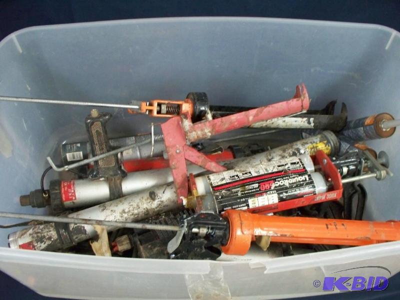 Large tote of various caulking guns...