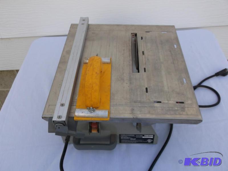 lot 57 image: Work Force tile saw powers up looks in good s...