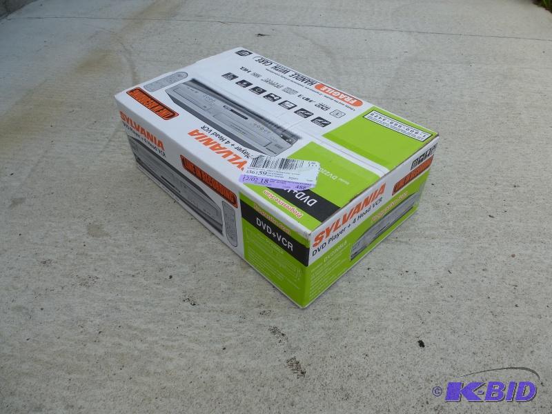 lot 18 image: Sylvania VCRDVD Player Brand New in box-&nb...