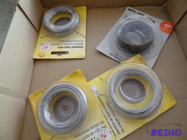 lot 216 image: 3 rolls of stainless wire. 1 roll of Dark Ann...