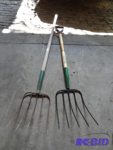 lot 230 image: 2 hay forks. Long one has a cracked handle...