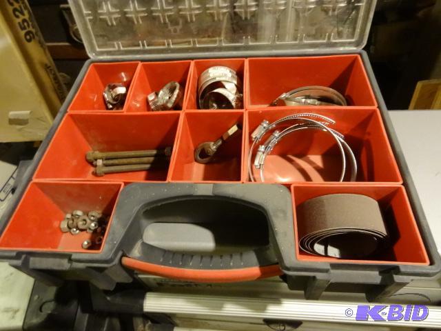 lot 282 image: Zag hardware case with misc hose clamps....