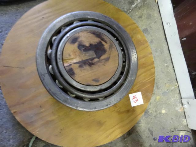lot 43 image: Large roller bearing on wood holder. Timken 8...