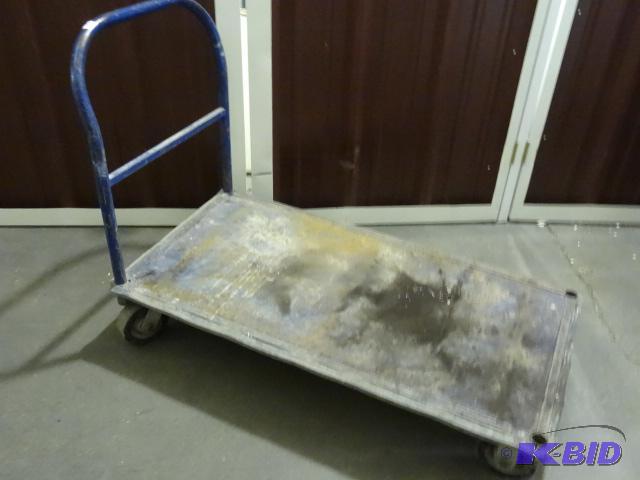 lot 85 image: Metal 4 wheel shop cart. 48 x 24...