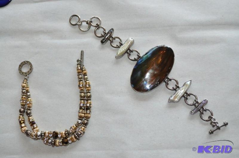 lot 11 image: 2 bracelets one says 925 silver on it and has...