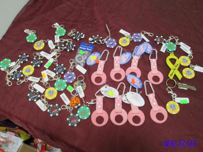 lot 340 image: Qty 28 Poker chips key chain, Qty 8 Breast Ca...