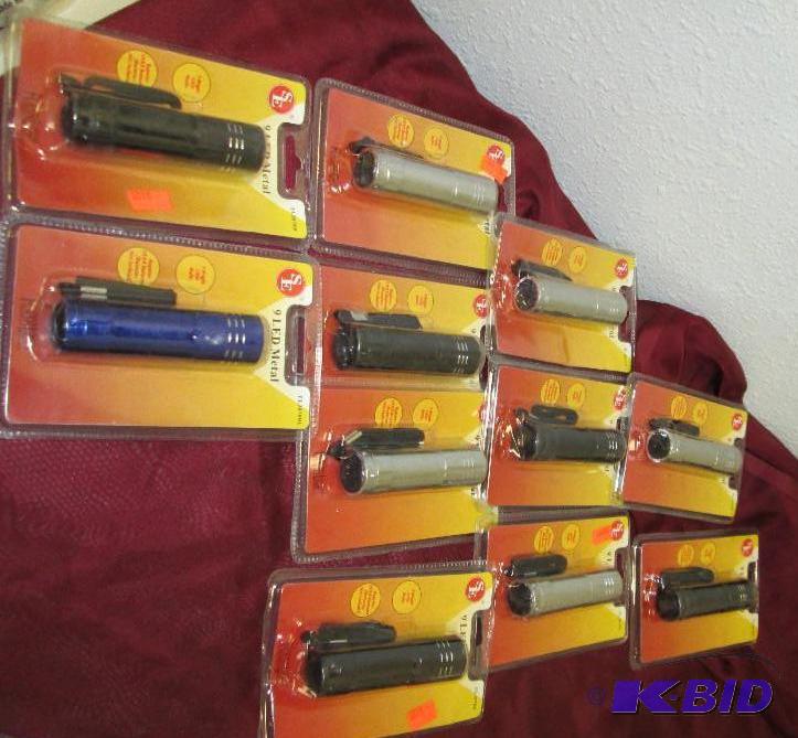 lot 74 image: Qty 11 SE 9 led metal flashlight, different c...