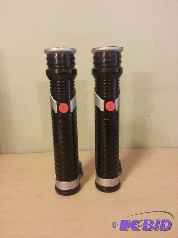 lot 106 image: Lot of 2 Lightsabers, 1 red and 1 green. Been...