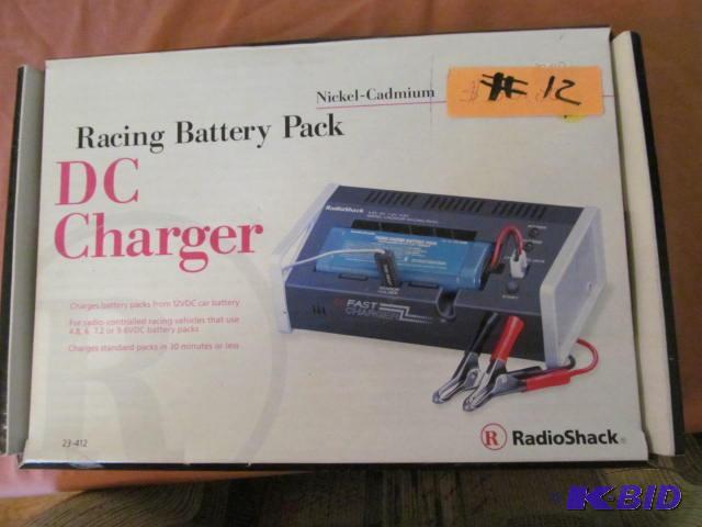lot 12 image: Brand new in box Racing battery Pack DC Charg...