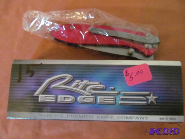 lot 15 image: Brand new in box, retractable pocket knife, R...