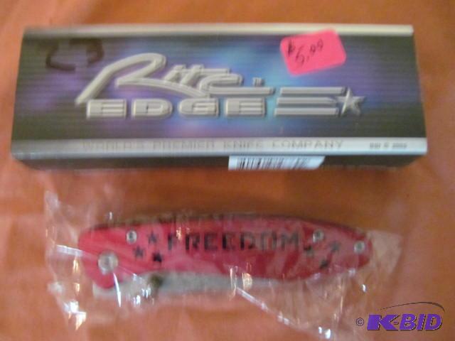 lot 23 image: Brand new in box, retractable pocket knife, R...
