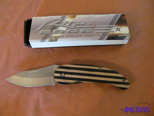 lot 24 image: Brand new in box, retractable pocket knife, R...