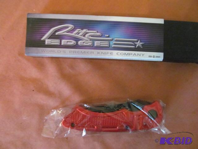 lot 25 image: Brand new in box, retractable pocket knife, R...