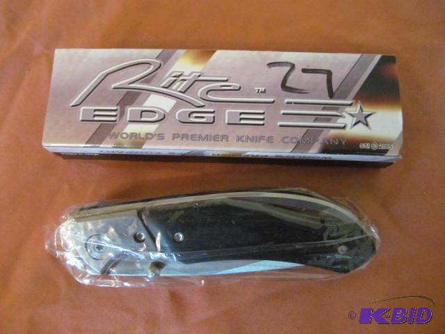 lot 27 image: Brand new in box, retractable pocket knife, R...
