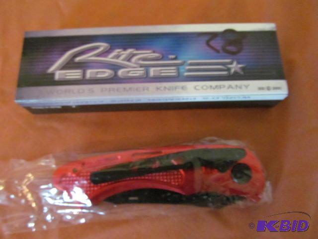 lot 28 image: Brand new in box, retractable pocket knife, R...