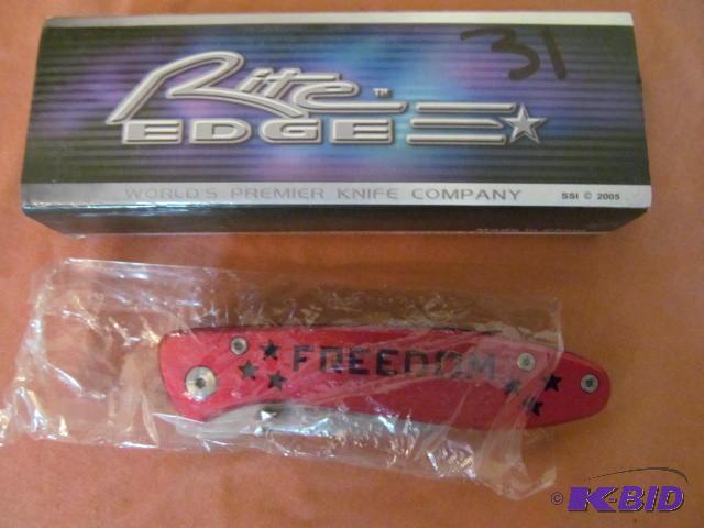 lot 31 image: Brand new in box, retractable pocket knife, R...