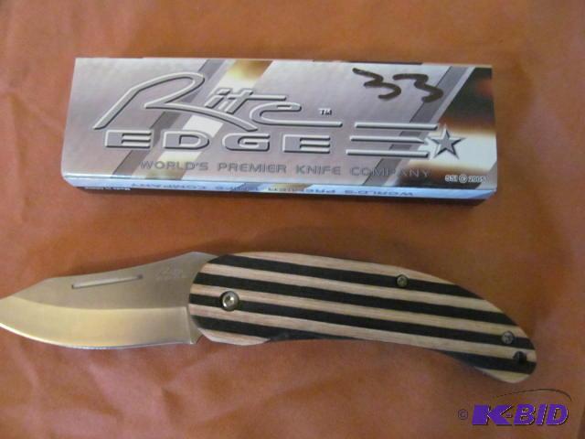 lot 33 image: Brand new in box, retractable pocket knife, R...
