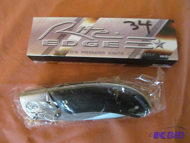 lot 34 image: Brand new in box, retractable pocket knife, R...