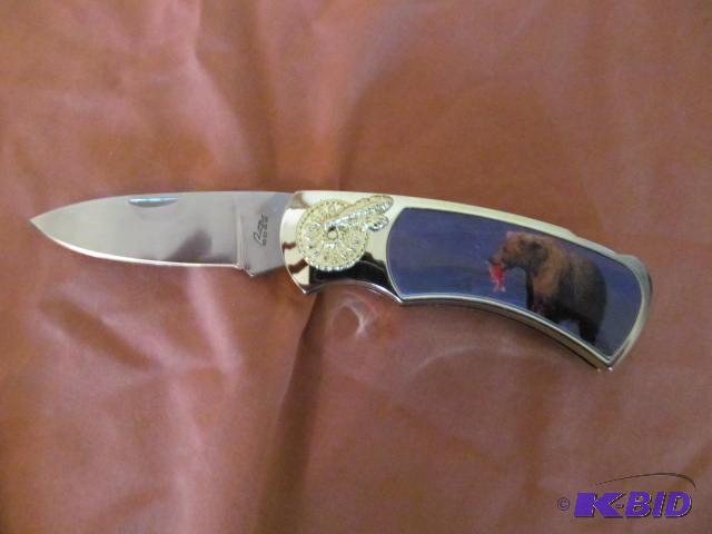 lot 42 image: Brand new in box, retractable pocket knife, p...