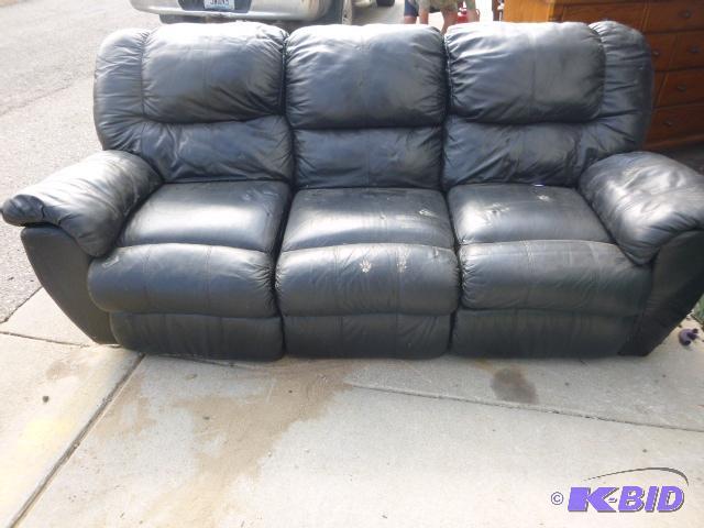 lot 142 image: Faux Leather Couch Each end is a recliner....